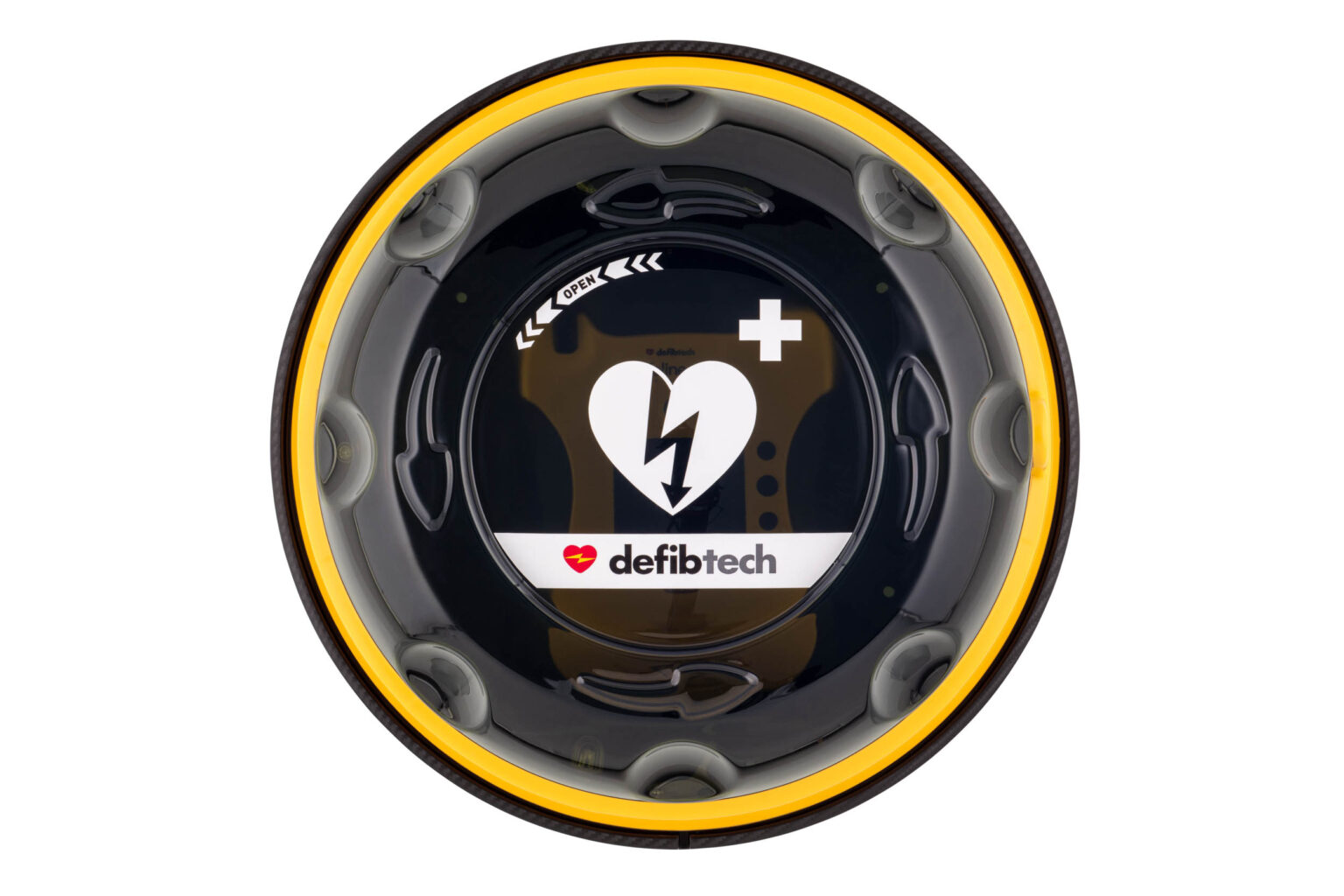 Dit beeld toont een automatische externe defibrillator (AED) van het merk Defibtech. De AED is ontworpen met een opvallende ronde vorm en is voorzien van een geel en zwart kleurenschema, wat bijdraagt aan zijn zichtbaarheid en herkenbaarheid in noodsituaties. Centraal op de AED is een symbool van een hart met een bliksemschicht zichtbaar, samen met het Defibtech-logo, wat aangeeft dat het apparaat is bedoeld om bij hartnoodgevallen te worden gebruikt. Fotograaf: Jan Buwalda, Groningen.